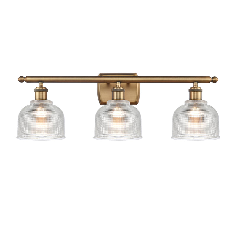 Dayton Bath Vanity Light shown in the Brushed Brass finish with a Clear shade