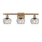 Fenton Bath Vanity Light shown in the Brushed Brass finish with a Clear shade