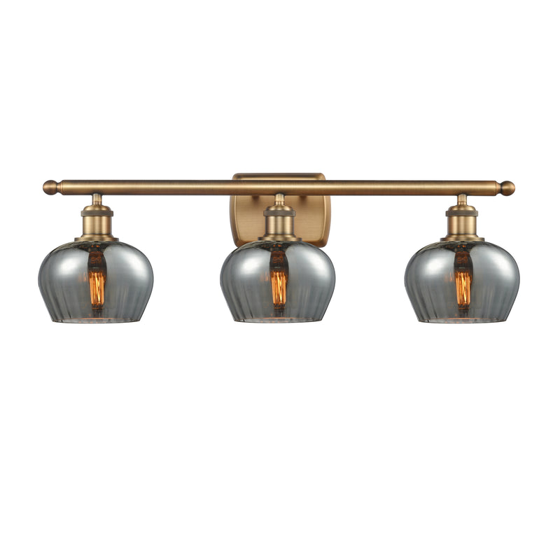 Fenton Bath Vanity Light shown in the Brushed Brass finish with a Plated Smoke shade