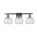 Deco Swirl Bath Vanity Light shown in the Oil Rubbed Bronze finish with a Clear shade