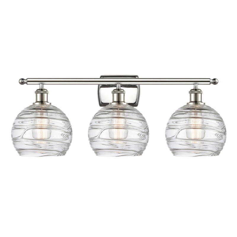 Deco Swirl Bath Vanity Light shown in the Polished Nickel finish with a Clear shade