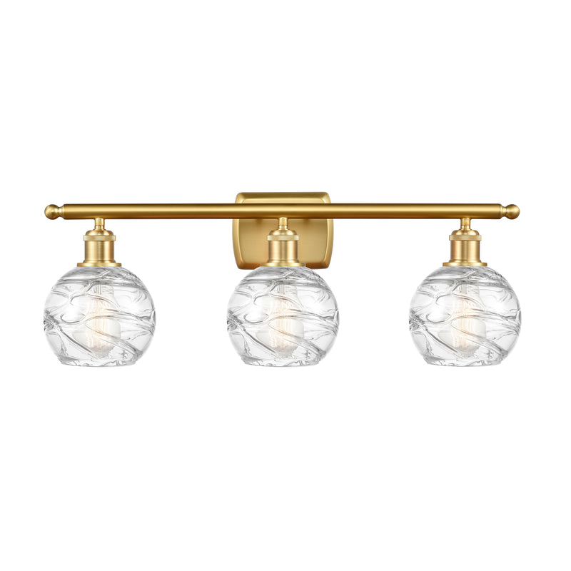 Deco Swirl Bath Vanity Light shown in the Satin Gold finish with a Clear shade