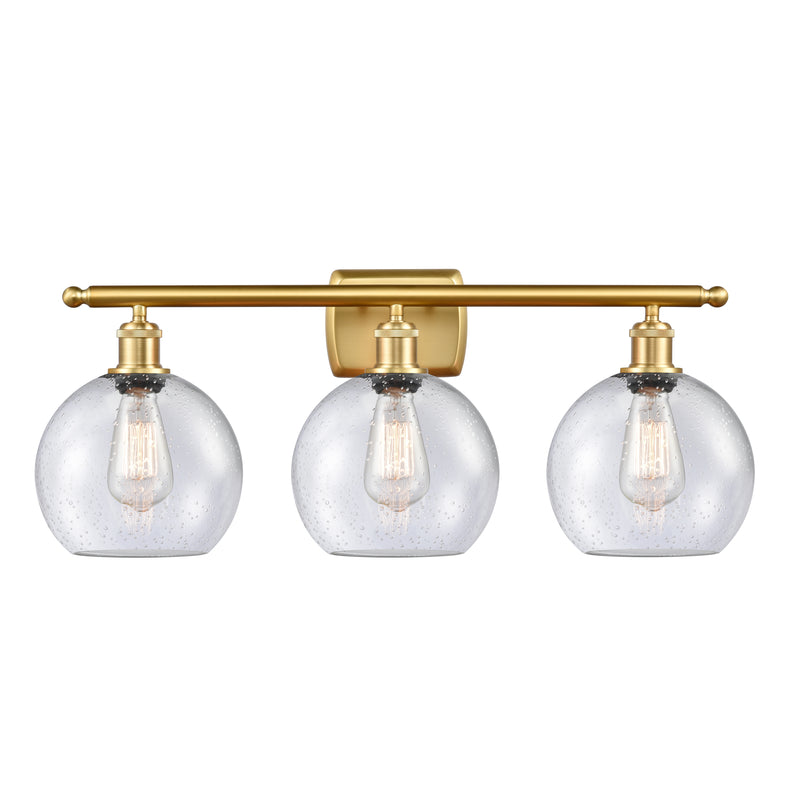 Athens Bath Vanity Light shown in the Satin Gold finish with a Seedy shade