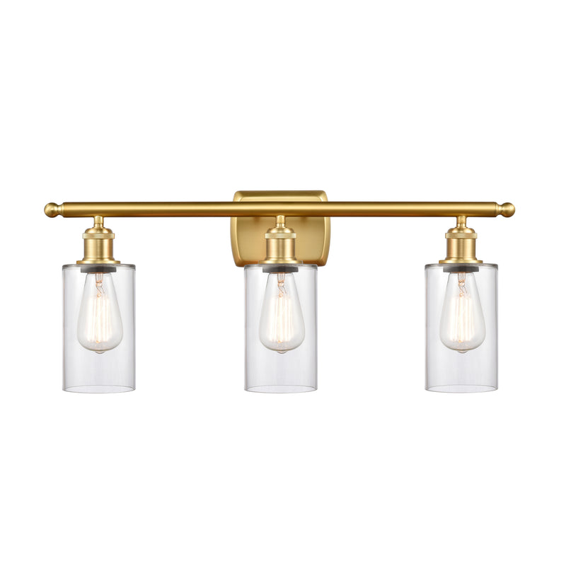 Clymer Bath Vanity Light shown in the Satin Gold finish with a Clear shade