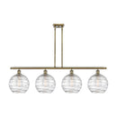 Deco Swirl Island Light shown in the Antique Brass finish with a Clear shade