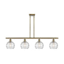 Deco Swirl Island Light shown in the Antique Brass finish with a Clear shade