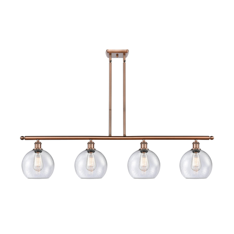 Athens Island Light shown in the Antique Copper finish with a Seedy shade