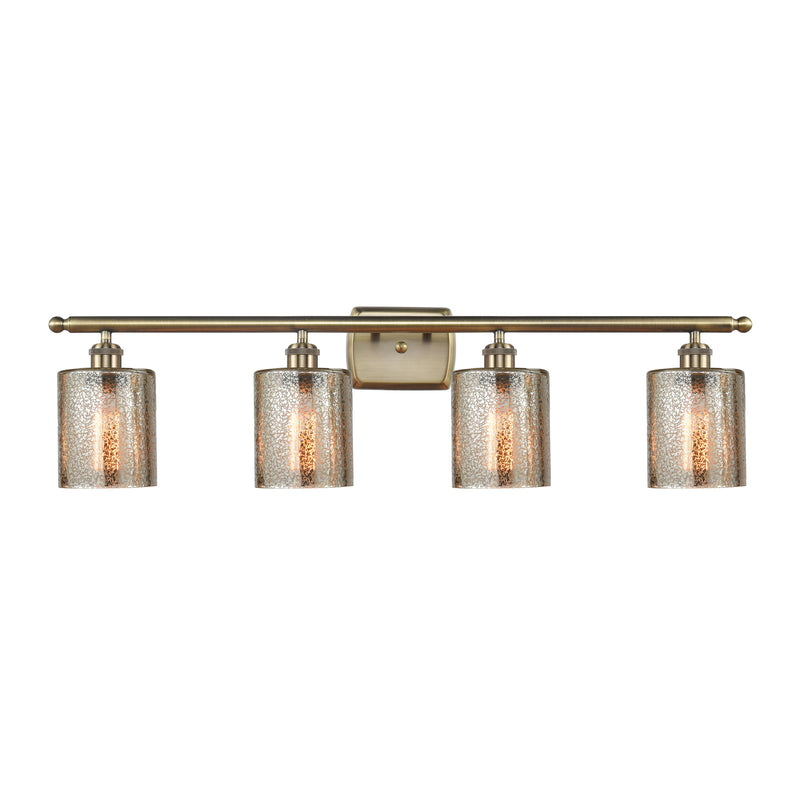 Cobbleskill Bath Vanity Light shown in the Antique Brass finish with a Mercury shade