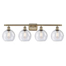 Athens Bath Vanity Light shown in the Antique Brass finish with a Seedy shade