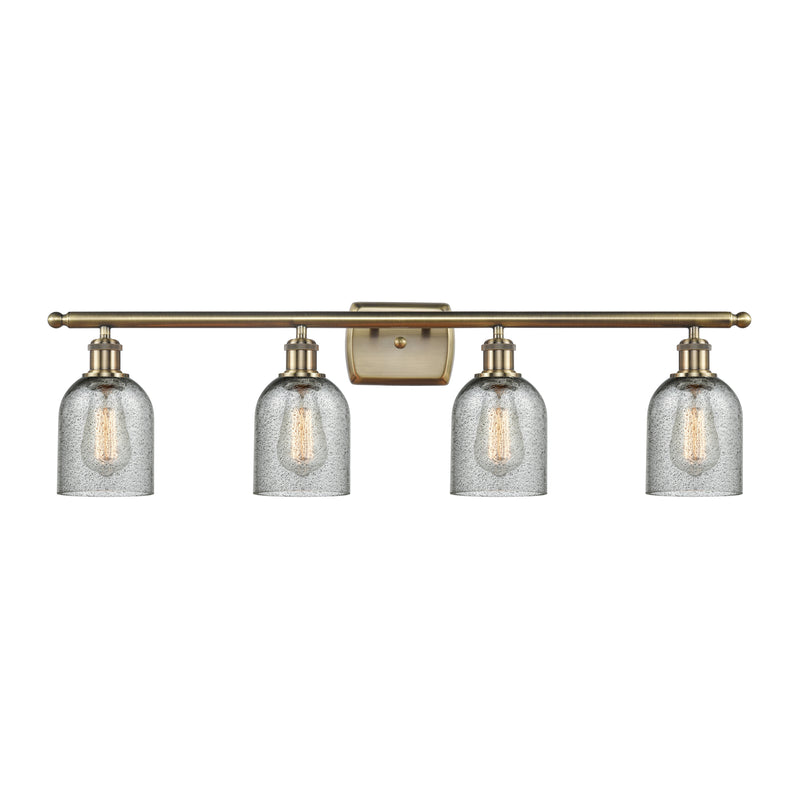 Caledonia Bath Vanity Light shown in the Antique Brass finish with a Charcoal shade