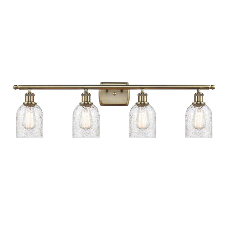 Caledonia Bath Vanity Light shown in the Antique Brass finish with a Mica shade