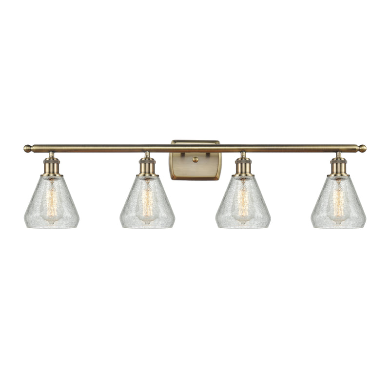 Conesus Bath Vanity Light shown in the Antique Brass finish with a Clear Crackle shade