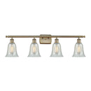 Hanover Bath Vanity Light shown in the Antique Brass finish with a Mouchette shade