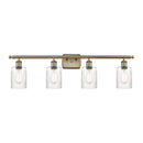 Hadley Bath Vanity Light shown in the Antique Brass finish with a Clear shade