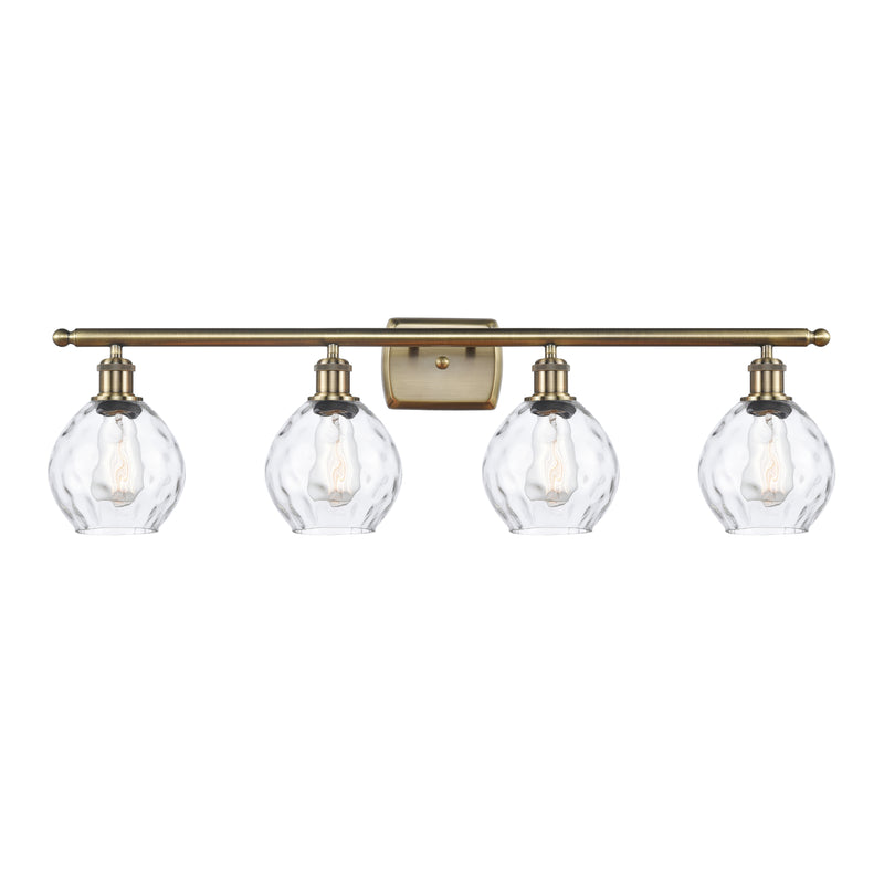 Waverly Bath Vanity Light shown in the Antique Brass finish with a Clear shade