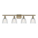 Castile Bath Vanity Light shown in the Antique Brass finish with a Clear shade