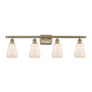 Ellery Bath Vanity Light shown in the Antique Brass finish with a White shade