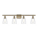 Ellery Bath Vanity Light shown in the Antique Brass finish with a Clear shade