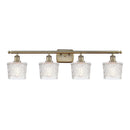 Niagra Bath Vanity Light shown in the Antique Brass finish with a Clear shade