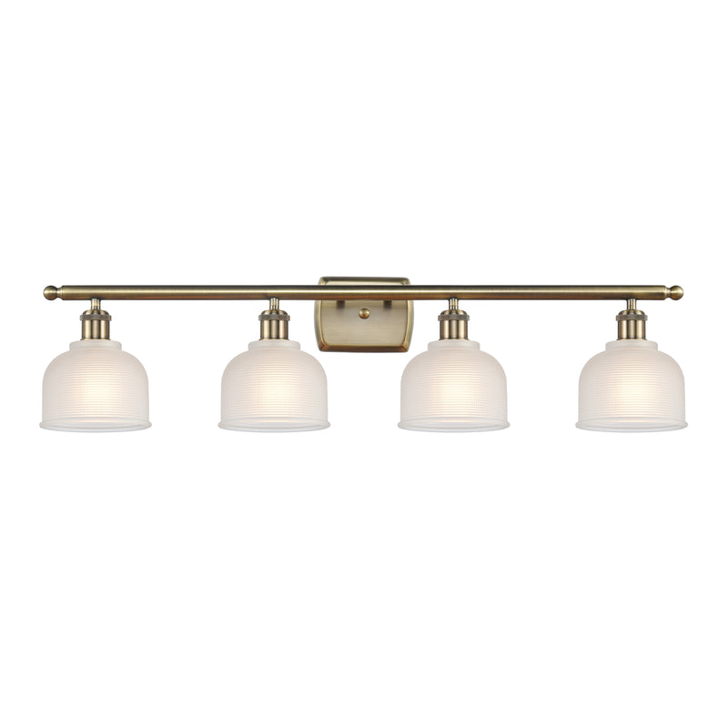 Dayton Bath Vanity Light shown in the Antique Brass finish with a White shade