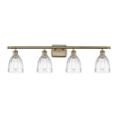 Brookfield Bath Vanity Light shown in the Antique Brass finish with a Clear shade