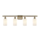 Clymer Bath Vanity Light shown in the Antique Brass finish with a Matte White shade