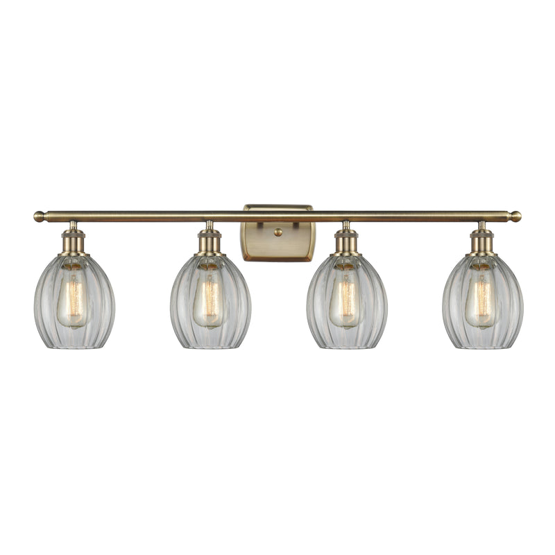 Eaton Bath Vanity Light shown in the Antique Brass finish with a Clear shade