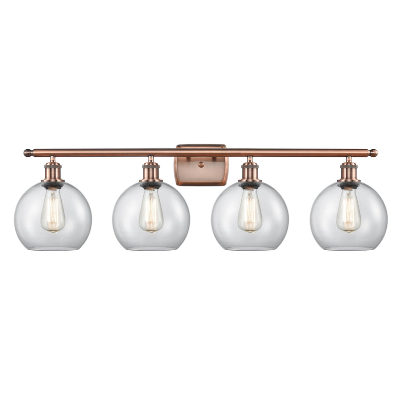 Athens Bath Vanity Light shown in the Antique Copper finish with a Clear shade