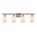 Hadley Bath Vanity Light shown in the Antique Copper finish with a Matte White shade