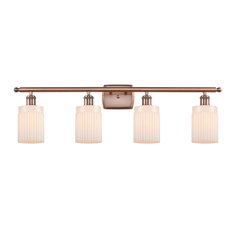 Hadley Bath Vanity Light shown in the Antique Copper finish with a Matte White shade