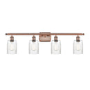 Hadley Bath Vanity Light shown in the Antique Copper finish with a Clear shade