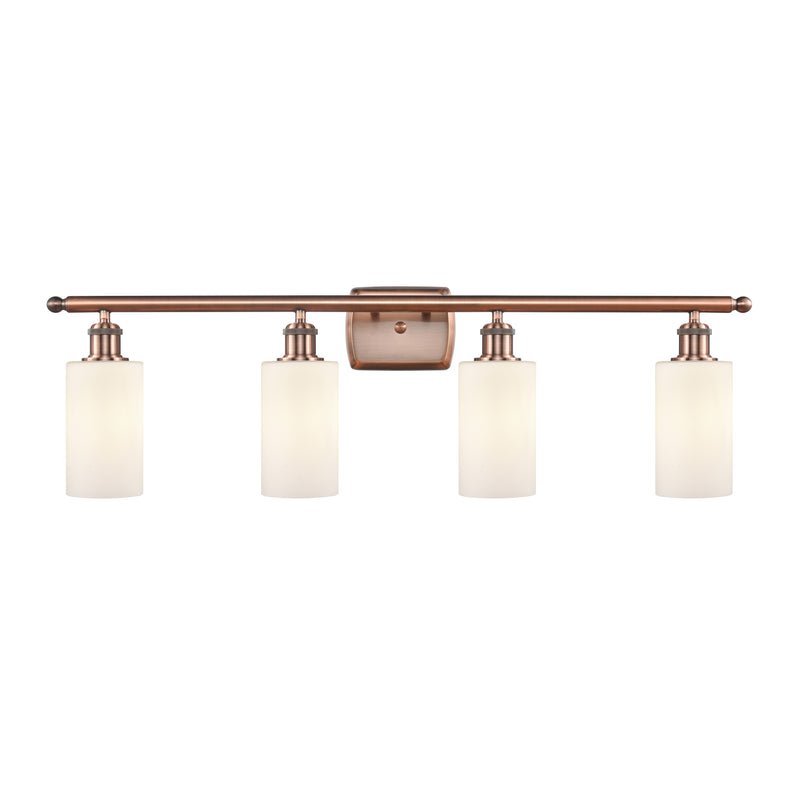 Clymer Bath Vanity Light shown in the Antique Copper finish with a Matte White shade