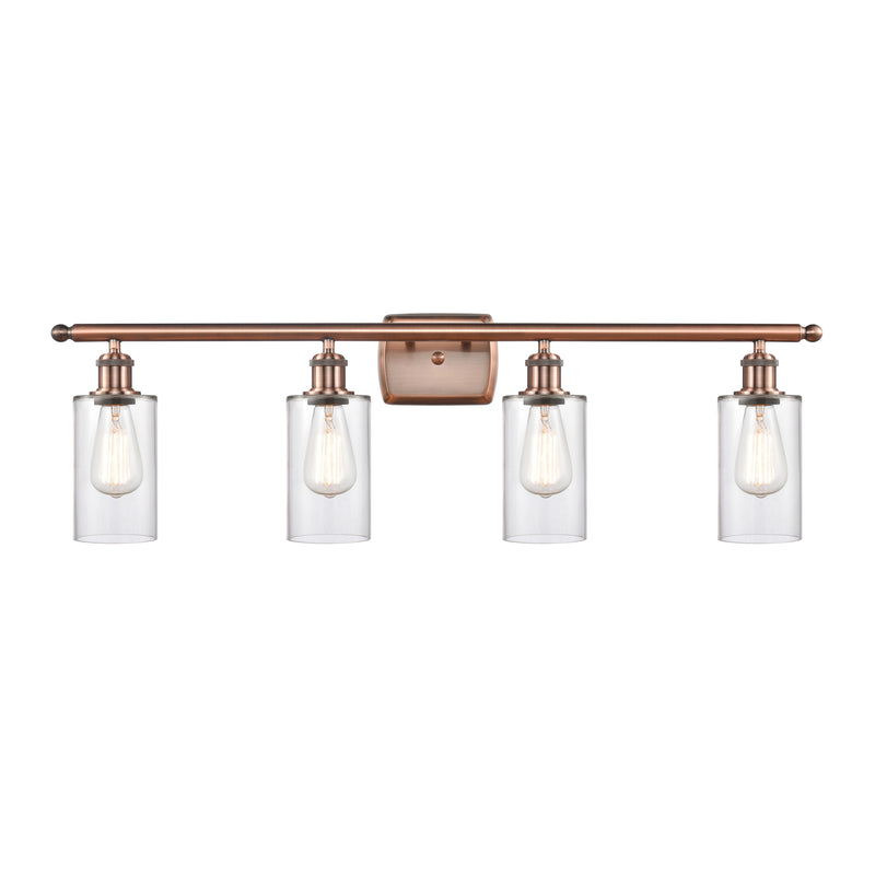 Clymer Bath Vanity Light shown in the Antique Copper finish with a Clear shade