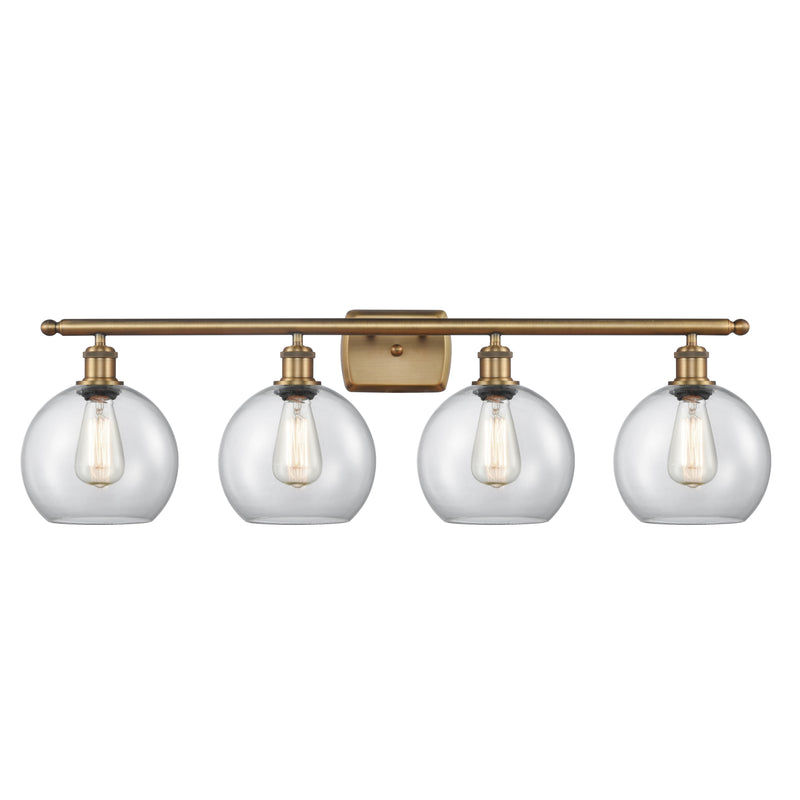 Athens Bath Vanity Light shown in the Brushed Brass finish with a Clear shade