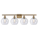 Athens Bath Vanity Light shown in the Brushed Brass finish with a Seedy shade