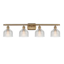 Dayton Bath Vanity Light shown in the Brushed Brass finish with a Clear shade