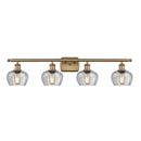 Fenton Bath Vanity Light shown in the Brushed Brass finish with a Clear shade