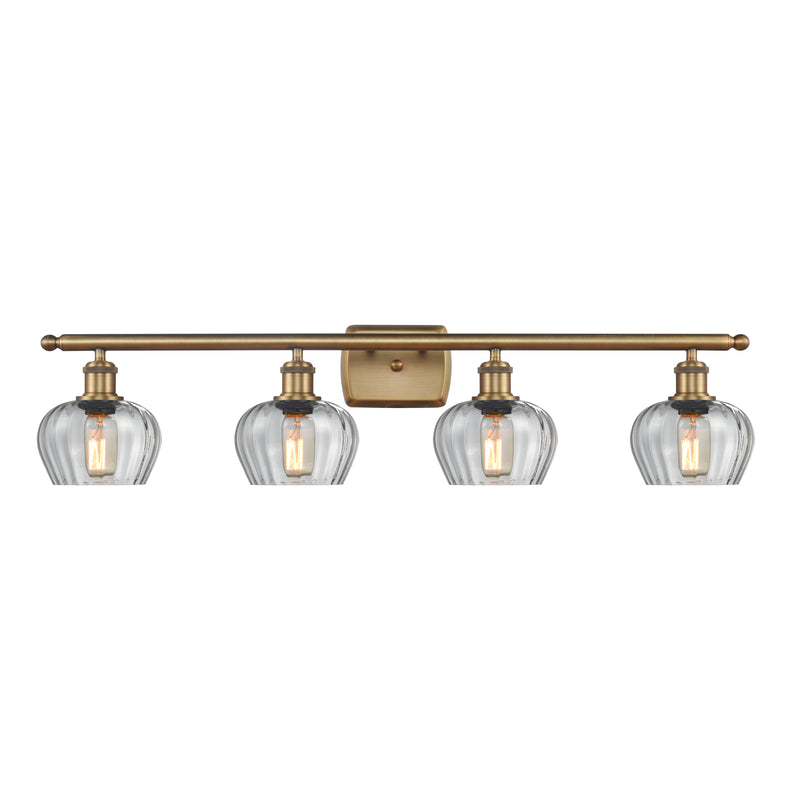 Fenton Bath Vanity Light shown in the Brushed Brass finish with a Clear shade