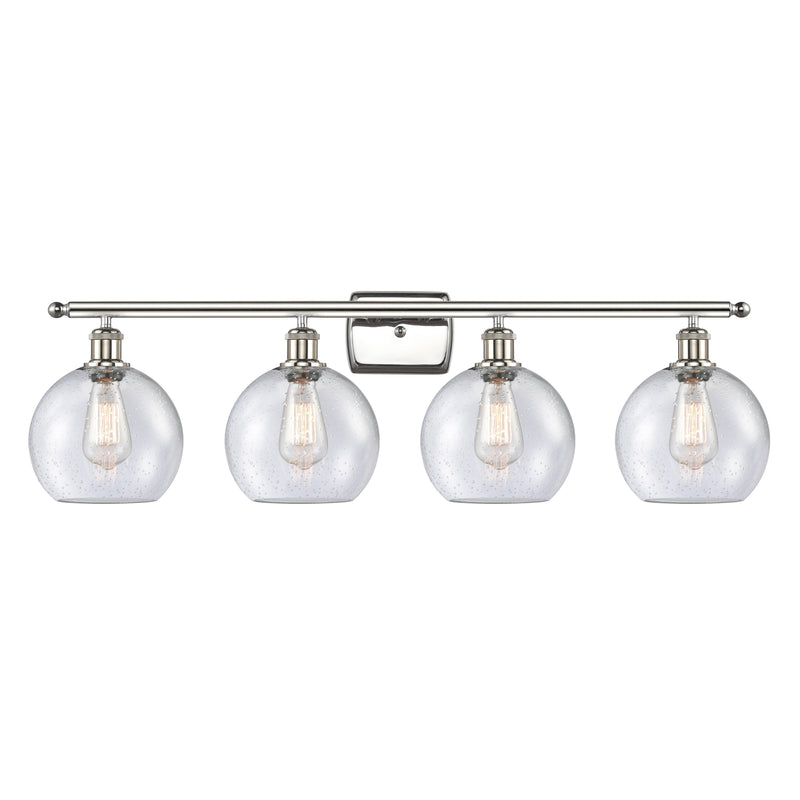 Athens Bath Vanity Light shown in the Polished Nickel finish with a Seedy shade