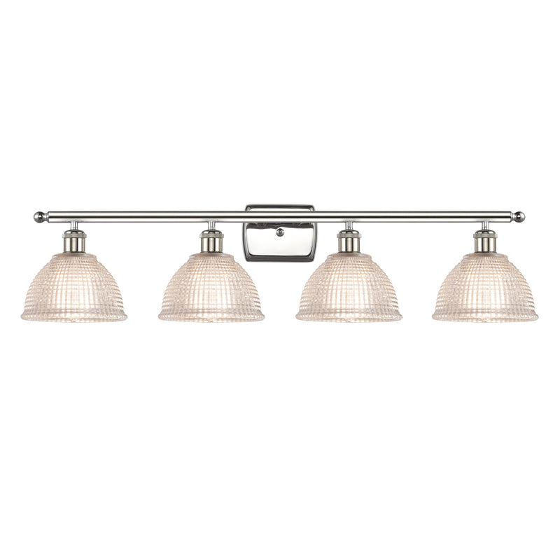 Arietta Bath Vanity Light shown in the Polished Nickel finish with a Clear shade