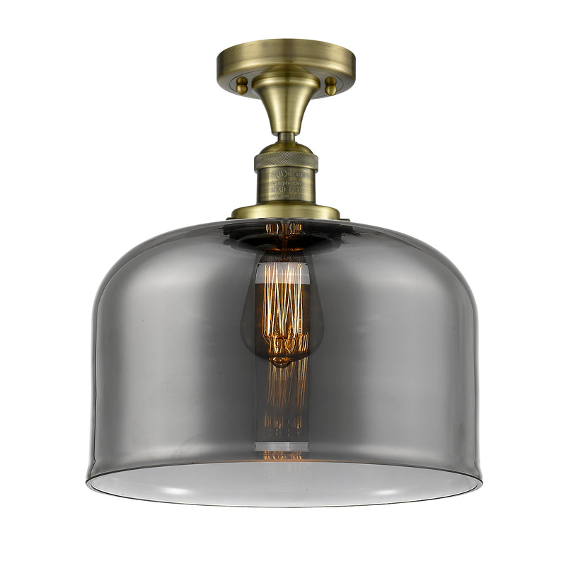 Bell Semi-Flush Mount shown in the Antique Brass finish with a Plated Smoke shade