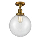 Beacon Semi-Flush Mount shown in the Brushed Brass finish with a Seedy shade