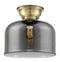 Bell Flush Mount shown in the Antique Brass finish with a Plated Smoke shade