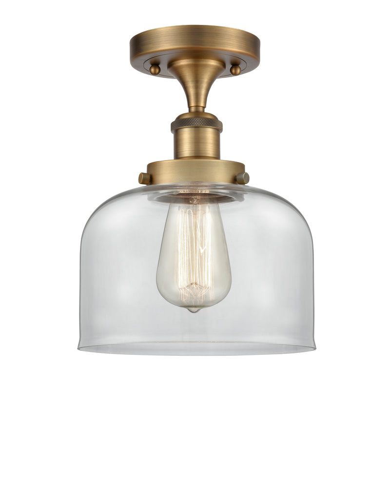 Bell Semi-Flush Mount shown in the Brushed Brass finish with a Clear shade