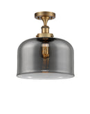 Bell Semi-Flush Mount shown in the Brushed Brass finish with a Plated Smoke shade