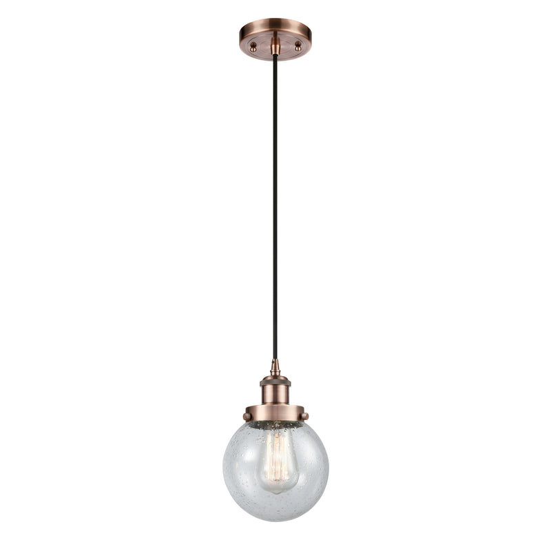 Beacon Mini Pendant shown in the Antique Copper finish with a Seedy shade