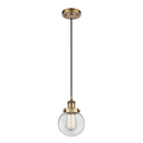 Beacon Mini Pendant shown in the Brushed Brass finish with a Clear shade