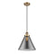 Cone Mini Pendant shown in the Brushed Brass finish with a Plated Smoke shade