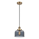 Bell Mini Pendant shown in the Brushed Brass finish with a Plated Smoke shade