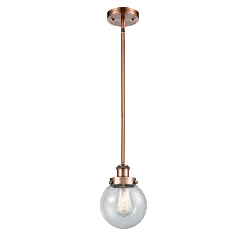 Beacon Mini Pendant shown in the Antique Copper finish with a Seedy shade